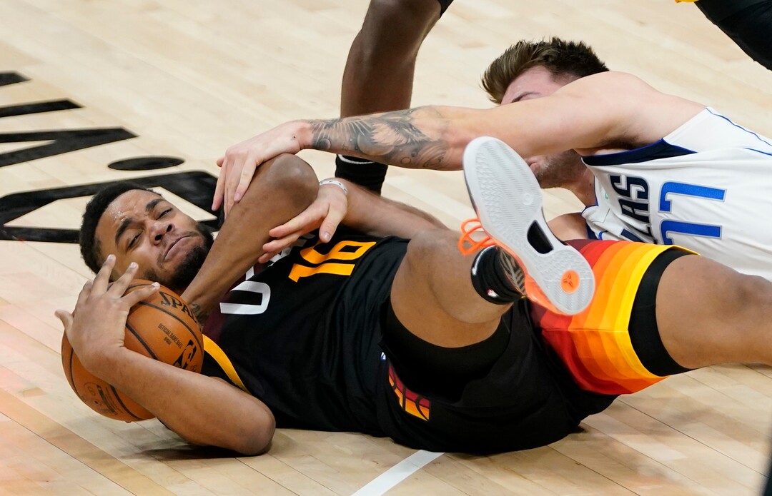 (Rick Egan | The Salt Lake Tribune)  Utah Jazz forward Juwan Morgan (16) goes for a loose ball along with Dallas Mavericks guard Luka Doncic (77), in NBA action between the Utah Jazz and the Dallas Mavericks at Vivint Arena, on Friday, Jan. 29, 2021.