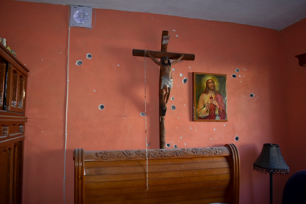 Bullet holes riddle the interior of a home after a gun battle between Mexican security forces and suspected cartel members, in Villa Union, Mexico, Saturday, Nov. 30, 2019. (AP Photo/Gerardo Sanchez)