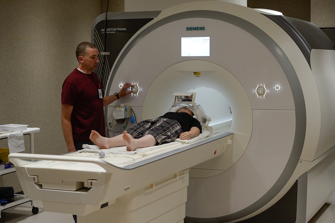 Francisco Kjolseth | The Salt Lake TribuneUniversity of Utah MRI Tech Michael Reading positions 11-year-old Bryce Hortin in the machine that will periodically capture images of his brain over a 10-year study. At the U of U, psychology professor Deborah Yurgelun-Todd aims to enroll 1,000 Utahns into a study that will ultimately include 12,000 across the country to monitor kids in their preteen and teen years.