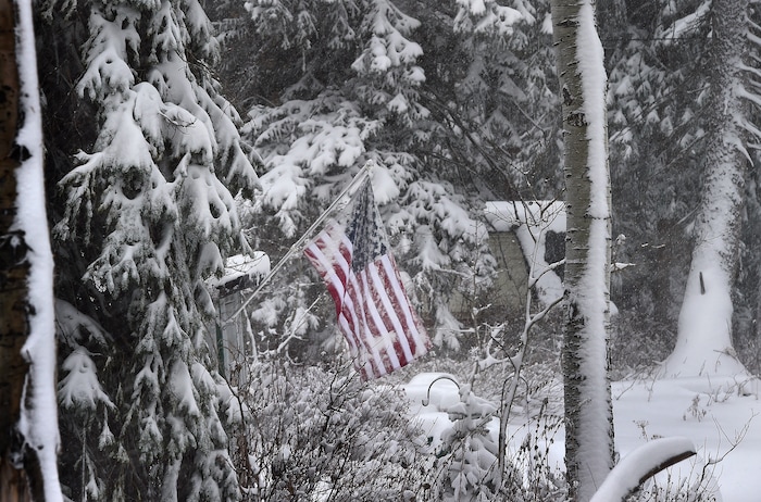 (Scott Sommerdorf | The Salt Lake Tribune)
A flag neglected in Big Cottonwood Canyon takes on some snow, Friday, November 17, 2017.