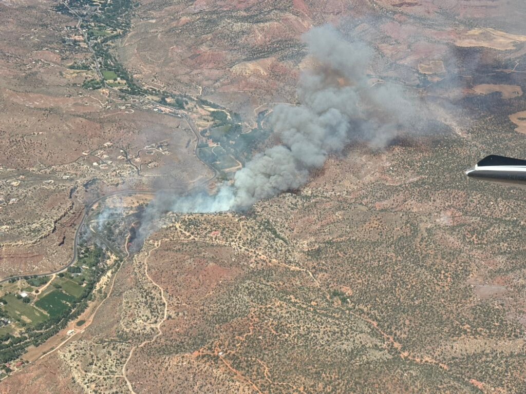 (Utah Fire Info via X) A plane flies over the Rockville Fire in Washington County, Friday, June 7, 2024.