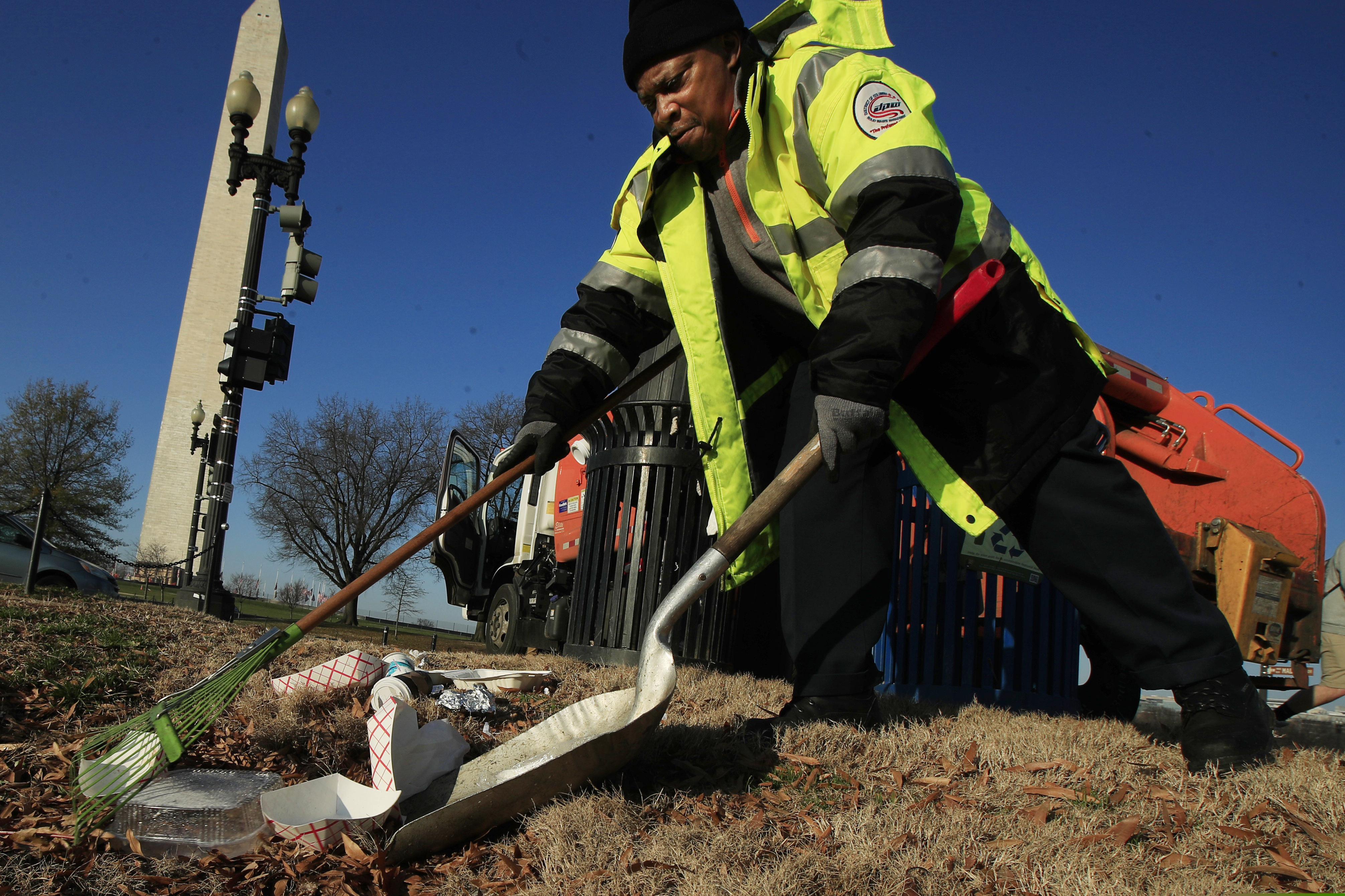 (Manuel Balce Ceneta | AP file photo) Jimmy Taylor of the Department of Public Works collects trash at the National Mall in Washington, Wednesday, Dec. 26, 2018. Partner organizations have assisted with trash collection while National Park Service staff are furloughed because of the partial government shutdown. But under an order signed Saturday by the Interior Department’s Acting Secretary David Bernhardt and obtained by The Washington Post, park managers will be permitted to bring on additional staff to clean restrooms, haul trash, patrol the parks and open areas that have been shut during the more than two-week budget impasse.