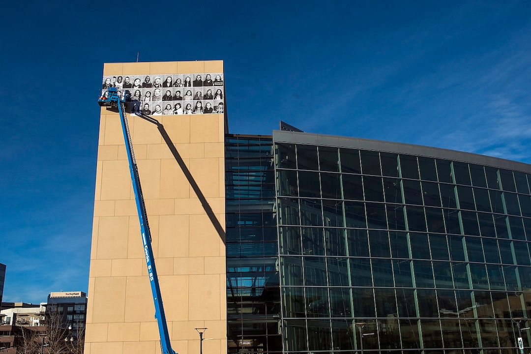 (Chris Detrick  |  The Salt Lake Tribune)  Jaime Scatena hangs portraits of Inside Out/Dreamers Project participants on the Salt Lake City Public Library Tuesday, November 21, 2017.  The Inside Out Project is a global participatory art project that gives everyone the opportunity to share their portrait and express what they stand for. In Utah, the future of more than 10,500 DACA recipients is being threatened by President Trump's decision to end the popular and successful DACA program.