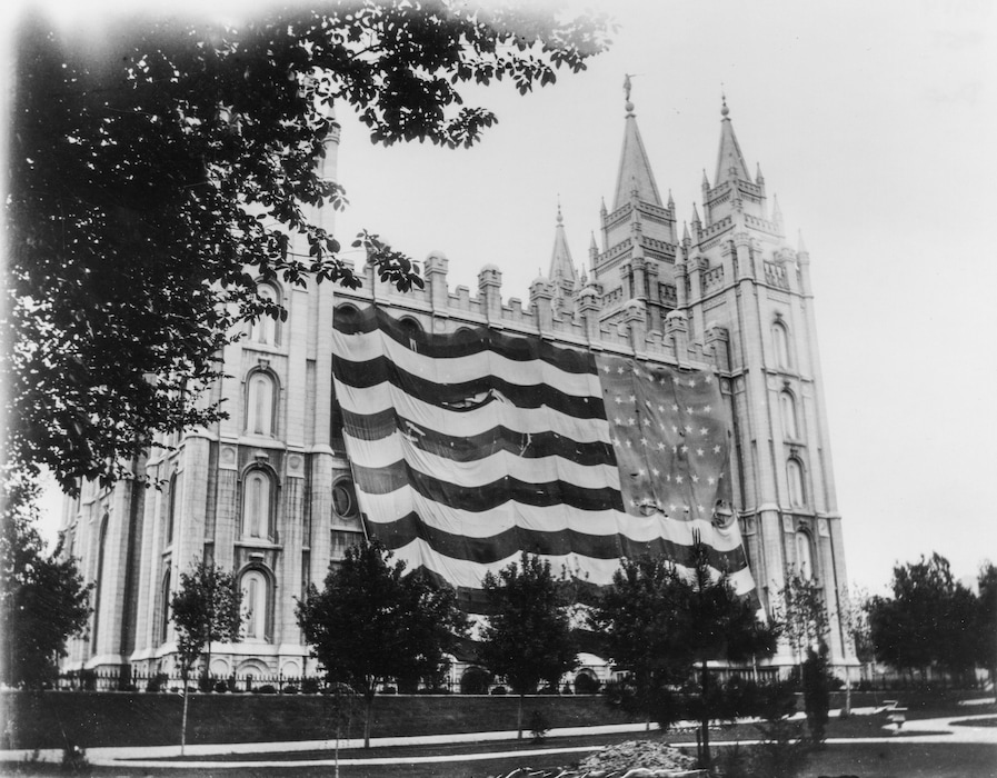 (George W. Reed via J. Willard Marriott Library, University of Utah) A large American flag hangs from the Salt Lake Temple commemorating Utah's statehood in 1896. Benjamin Park's new book notes this was the largest Old Glory to date, measuring 132 feet by 74 feet.