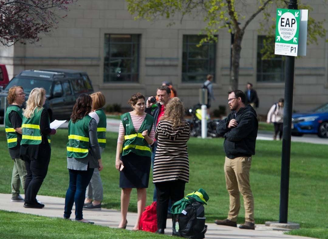 (Rick Egan  |  The Salt Lake Tribune)   Emergency response captains wear their green vests as they meet at an emergency assembly point in Presidents Circle on the University of Utah campus, during the Great Utah ShakeOut Annual Statewide Earthquake Drill Thursday, April 19, 2018.