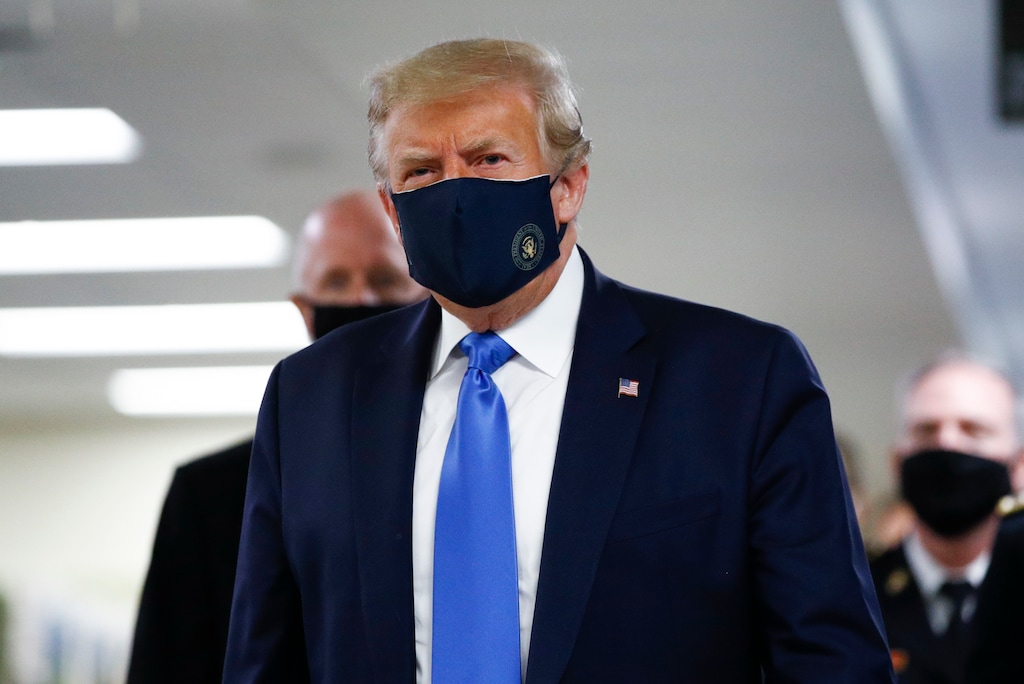 President Donald Trump wears a mask as he walks down the hallway during his visit to Walter Reed National Military Medical Center in Bethesda, Md., Saturday, July 11, 2020. (AP Photo/Patrick Semansky)