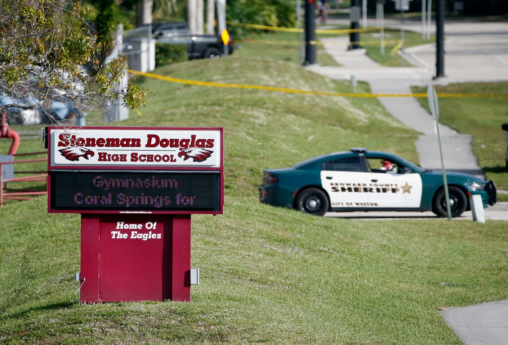 (Wilfredo Lee | The Associated Press) In this Feb. 15, 2018, file photo, law enforcement officers block off the entrance to Marjory Stoneman Douglas High School, in Parkland, Fla., following a deadly shooting at the school. Vista Outdoor Inc., among the nation’s largest ammunition makers in America, will stop selling firearms following the massacre at Marjorie Stoneman Douglas High. The company has been pressured for months by other retailers that carry other goods, like Bell bicycle helmets and CamelBak. Vista Outdoor Inc. said Tuesday, May 1 that it will focus on retail products aimed at outdoor enthusiasts.  The company said it would continue to sell ammunition, which it included as one of its core businesses.