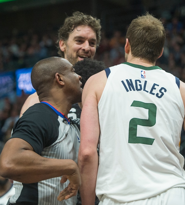 (Rick Egan  |  The Salt Lake Tribune)   referee Tony Brown (6) jumps between San Antonio Spurs center Pau Gasol (16) and Utah Jazz forward Joe Ingles (2) after Ingles was fouled, in NBA action, in Salt Lake City, Monday, February 12, 2018.