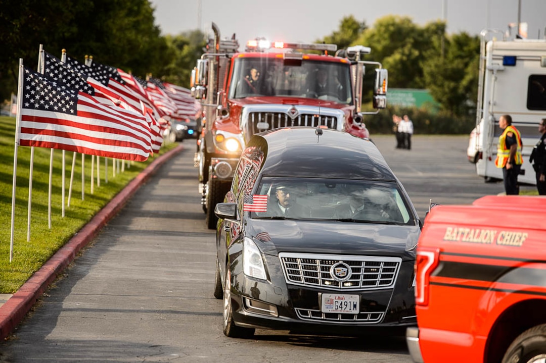 (Trent Nelson | The Salt Lake Tribune)  The procession arrives for the funeral services for Battalion Chief Matthew Burchett at the Maverik Center in West Valley City, Monday Aug. 20, 2018.