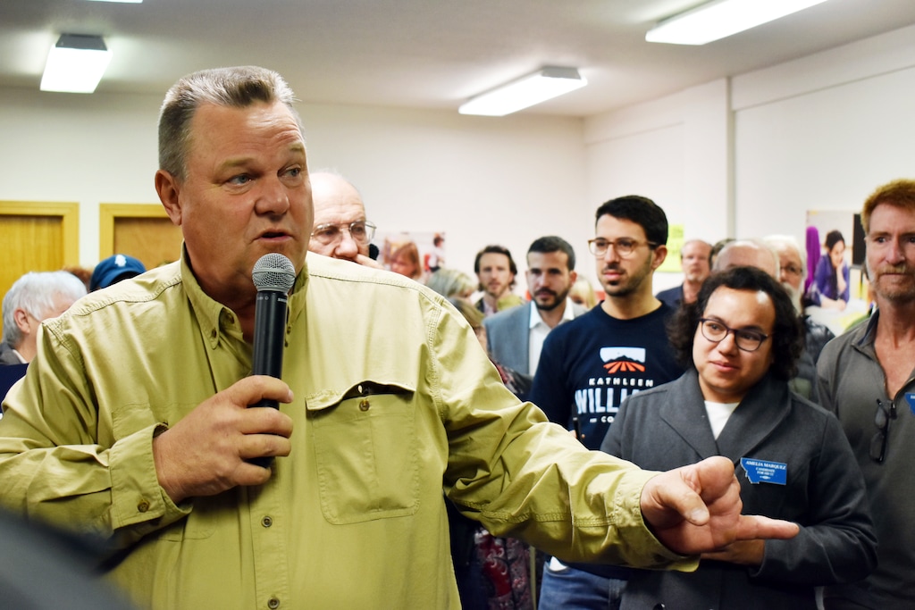 Montana Democratic Sen. Jon Tester talks with supporters at a campaign rally at the Billings Education Association headquarters in Billings, Mont., Friday, Oct. 26, 2018. Conservative groups linked to wealthy donors are saturating Montana airwaves with ads attacking Tester as they try to capitalize on President Donald Trump's feud with the lawmaker. (AP Photo/Matthew Brown)