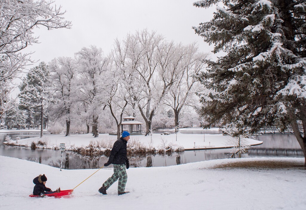 (Rick Egan  |  The Salt Lake Tribune) Jenda Michl pulls 4-year-old Mason Michl on a sled at Liberty Park, Friday, Nov. 29, 2019. Another storm is expected on Thursday, with snow in the valleys Friday into Saturday.