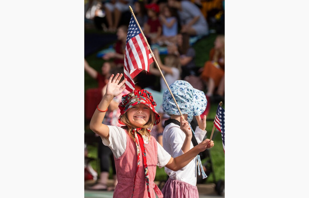 (Rick Egan | The Salt Lake Tribune) Kjersti Orme, waves to the crowd as she walks tie the Sons of the Utah Pioneers, in the Days of '47 Parade, in Salt Lake City, on Friday, July 23, 2021.