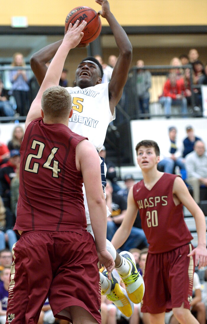 (Leah Hogsten  |  The Salt Lake Tribune) Summit's Jalexus Gilson shoots around Juab's Raiden Gould. Juab High School boys' basketball team defeated Summit Academy 61-58 in overtime during their 3A State tournament game in Heber  Saturday, Feb. 16, 2018.