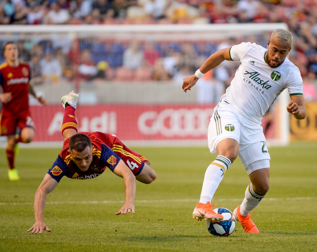 Leah Hogsten  |  The Salt Lake Tribune Real Salt Lake defender Donny Toia (4) and Portland Timbers defender Bill Tuiloma (25) battle for possession.  Real Salt Lake hosts the Portland Timbers, Saturday, May 4, 2019 at Rio Tinto Stadium in Salt Lake City.