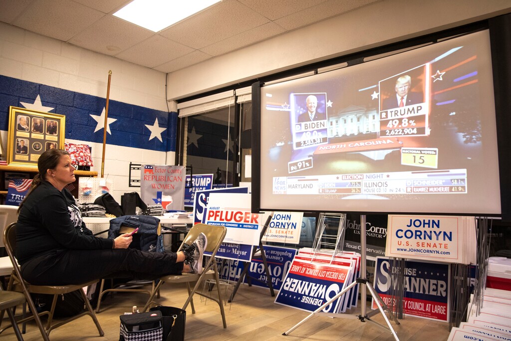 Julie Drainer watches election night coverage at Ector County Republican Headquarters on Tuesday, Nov. 3, 2020, in Odessa, Texas. (Odessa American/Eli Hartman)/Odessa American via AP)