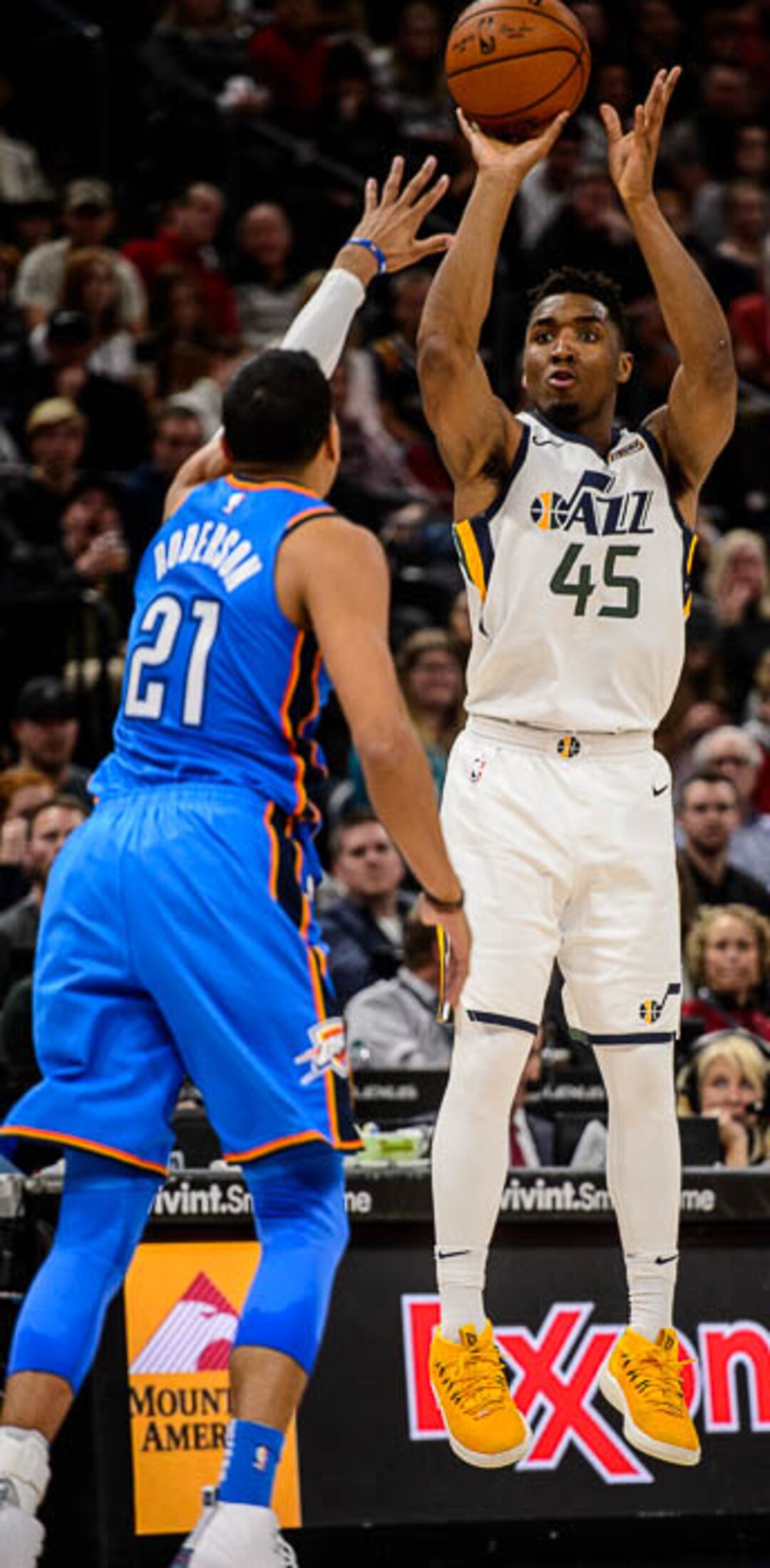 (Trent Nelson | The Salt Lake Tribune)  Utah Jazz guard Donovan Mitchell (45) shoots over Oklahoma City Thunder guard Andre Roberson (21) as the Utah Jazz host the Oklahoma City Thunder, NBA basketball in Salt Lake City, Saturday December 23, 2017.