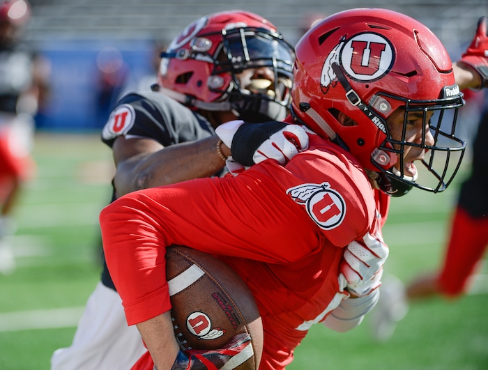 (Francisco Kjolseth  |  The Salt Lake Tribune)  Solomon Enis, #21, battles Vonte Davis, #19, as the Utah Utes hold their first of two major scrimmages of spring practice at Rice Eccles stadium on Saturday, March 30, 2019, prior to the April 13 Red-White Game. 