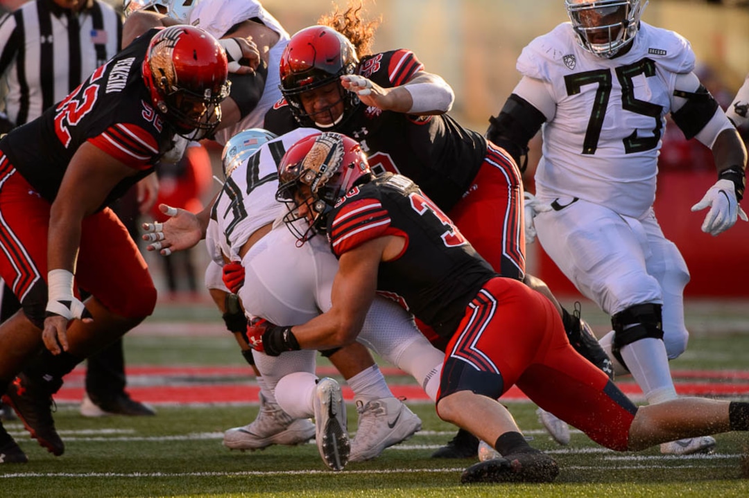 (Trent Nelson | The Salt Lake Tribune)  Utah Utes linebacker Cody Barton (30) tackles Oregon Ducks running back CJ Verdell (34). Utah Utes host the Oregon Ducks, NCAA football at Rice-Eccles Stadium in Salt Lake City on Saturday Nov. 10, 2018.