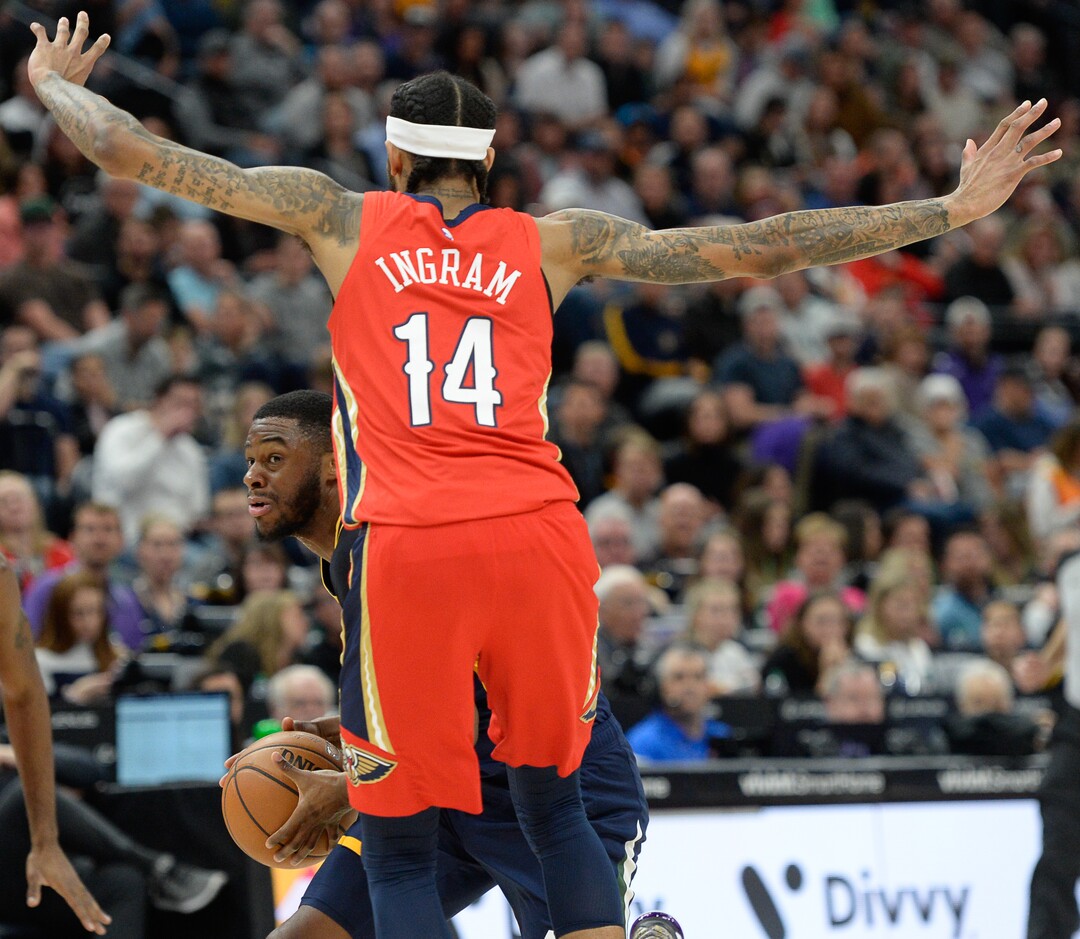 (Francisco Kjolseth  |  The Salt Lake Tribune)  Utah Jazz guard Emmanuel Mudiay (8) looks around New Orleans Pelicans forward Brandon Ingram (14) as the Utah Jazz host the New Orleans Pelicans in their NBA basketball game at Vivint Smart Home Arena in Salt Lake City on Sat. Nov. 23, 2019.