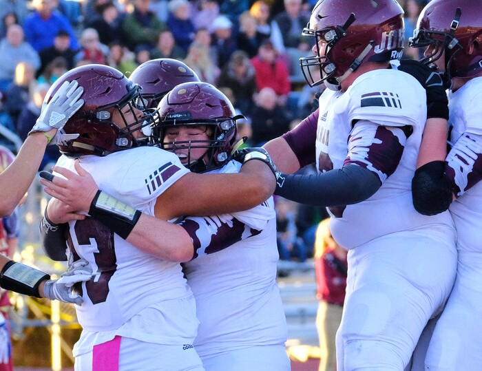 (Leah Hogsten  |  The Salt Lake Tribune) Jordan's Soni Vunipola celebrates his touchdown with the team.  Jordan High School boys' football team leads Viewmont High School 14-10 at the half during their class 5A football playoff opener, Friday, October 27, 2017 in Bountiful