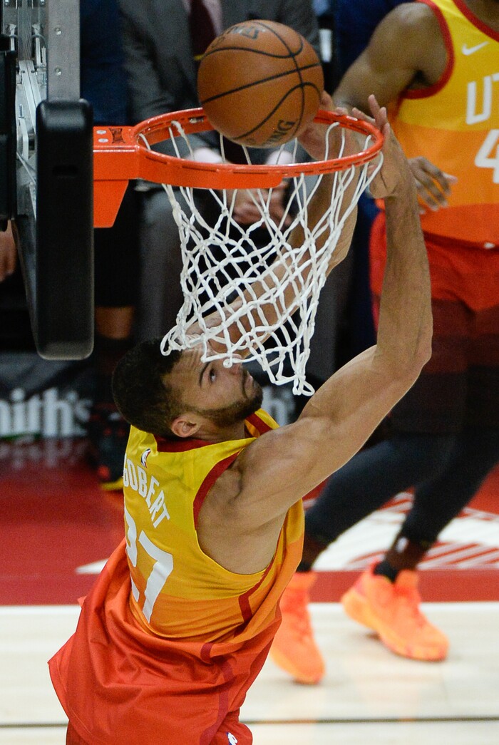 (Francisco Kjolseth  |  The Salt Lake Tribune)   Utah Jazz center Rudy Gobert (27) sinks one in over the Thunder in the NBA game at Vivint Smart Home Arena Sat., Dec. 22, 2018, in Salt Lake City.