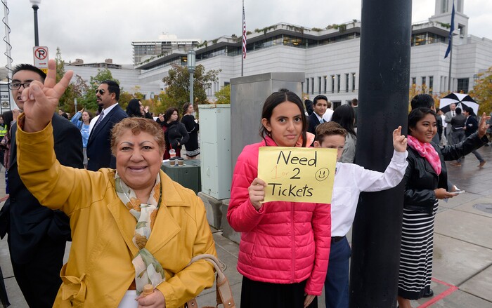 (Al Hartmann  |  The Salt Lake Tribune) 	
Members of the Church of the Jesus Christ of Latter Day Saints signal for any extra tickets to attend General Conference Oct. 1 2017. 