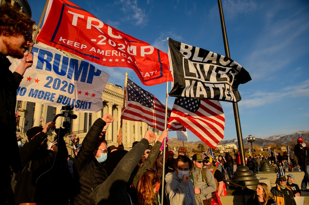 (Trent Nelson  |  The Salt Lake Tribune) Trump supporters surround a small group holding a Black Lives Matter Flag at the State Capitol in Salt Lake City on Wednesday, Jan. 6, 2021.