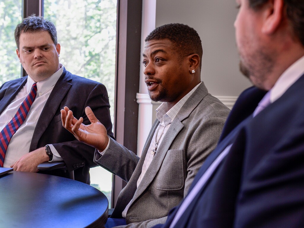 (Leah Hogsten | The Salt Lake Tribune) Jeffery Ryans talks about his case with his attorney Gabriel White, left and Attorney Dan Garner, Aug. 5, 2020. Ryans is suing Salt Lake City police after he says officers used excessive force when they commanded a police dog to attack him repeatedly while he was on his knees with his hands in the air. Body camera footage shows the officer continued to order the dog to bite Ryans even after another officer sat on him and handcuffed him. Ryans' left leg was severely injured by the dog's bites.