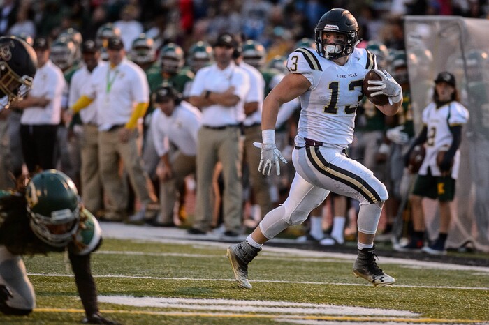 (Trent Nelson | The Salt Lake Tribune) Lone Peak's Masen Wake runs for a touchdown as Kearns hosts Lone Peak, high school football, Thursday September 14, 2017.