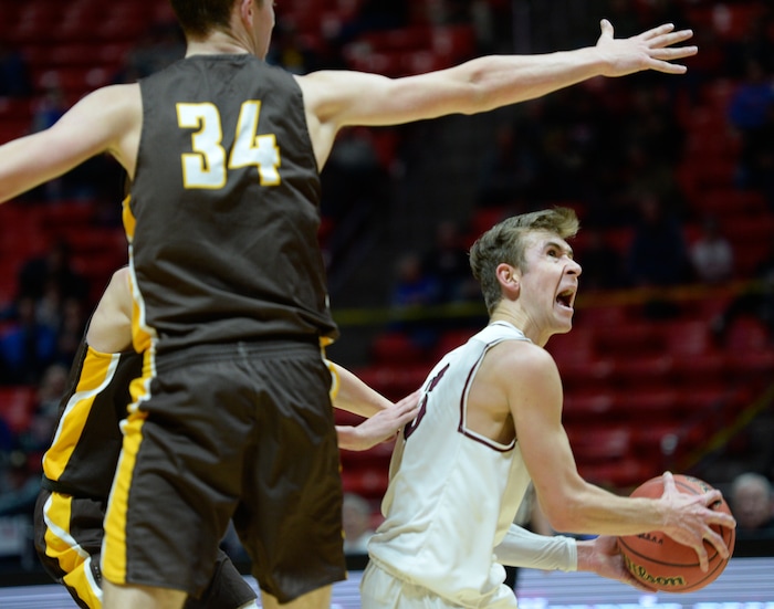 (Francisco Kjolseth  |  The Salt Lake Tribune)  Davis vs Lone Peak, 6A State high school basketball tournament at the Huntsman Center in Salt Lake City, Thursday March 1, 2018. Steven Ashworth (3) of Lone Peak spots his mark while pressured by Davis. 