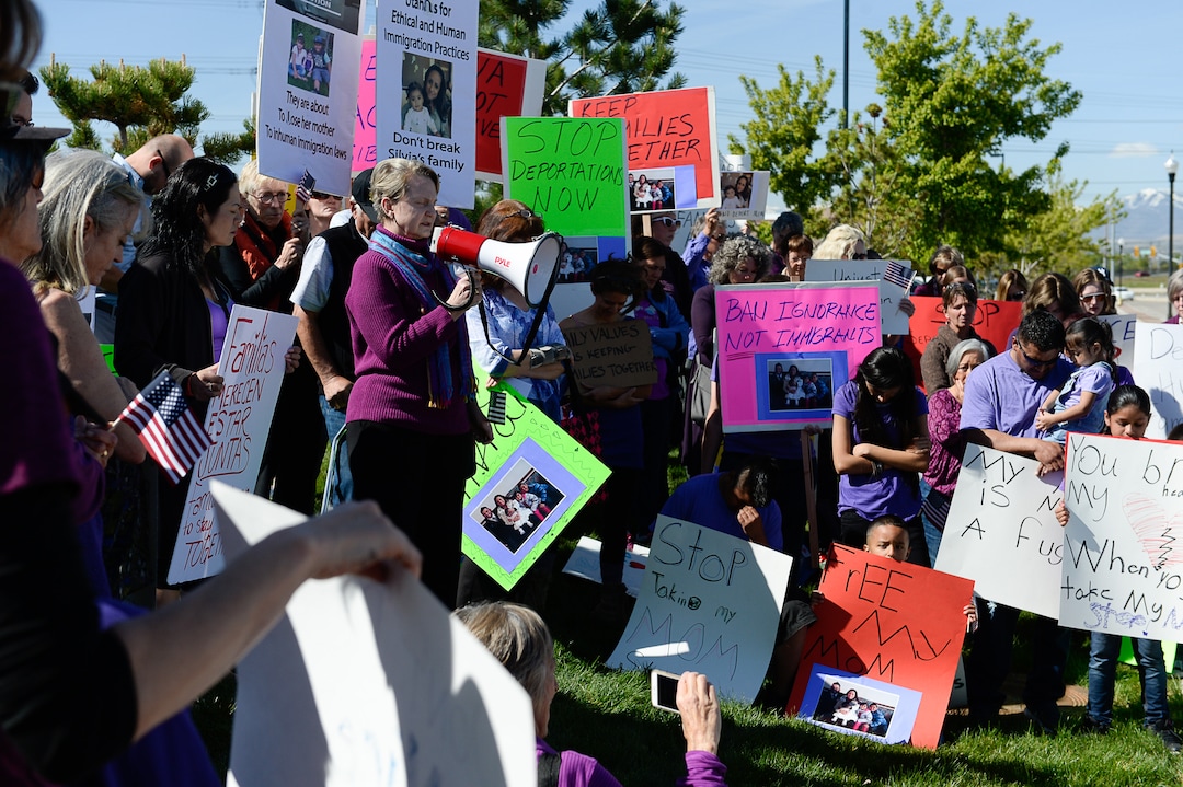 (Francisco Kjolseth | The Salt Lake Tribune)  Linda Hoffman, one of the founders of Mormon Women for Ethical Government leads a prayer alongside other concerned citizens who gathered at the Department of Homeland Security field office in West Valley City on Wed. May 3, 2017, in a show of solidarity for a young mother named Silvia, who was arrested by ICE agents last week.