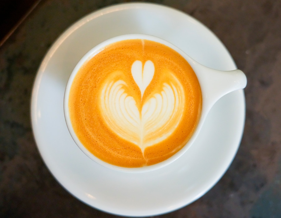 (Bethany Baker | The Salt Lake Tribune) A latte sits on the counter at Three Pines Coffee in downtown Salt Lake City on Tuesday, Feb. 6, 2024. The coffee shop's owner has recently instituted a no-tipping policy, and has raised prices by the amount people would usually tip — so the owner can raise his employee's wages.