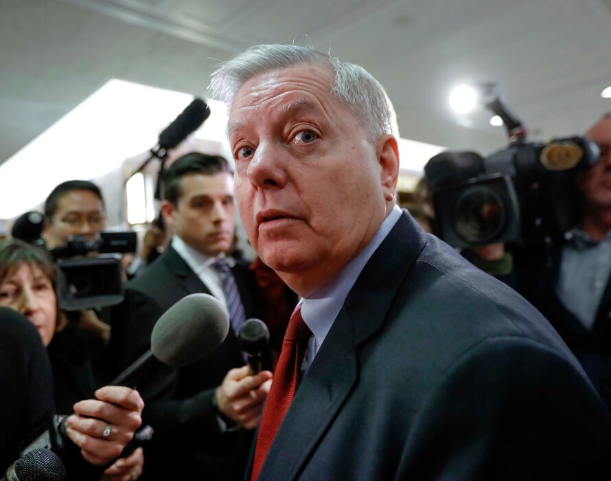 In this Jan. 25, 2018 photo, Sen. Lindsey Graham, R-S.C., speaks to reporters as he arrives at the office of Sen. Susan Collins, R-Maine, who is moderating bipartisan negotiations on immigration, at the Capitol in Washington.  (AP Photo/J. Scott Applewhite)