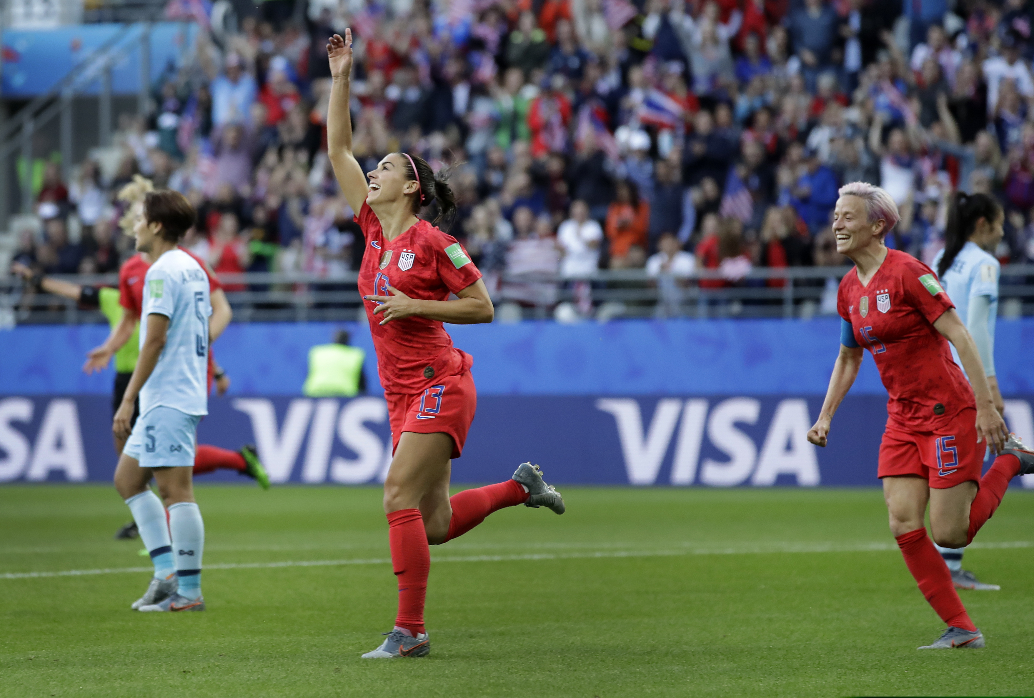 United States' Alex Morgan, left, celebrates after scoring the opening goal during the Women's World Cup Group F soccer match between United States and Thailand at the Stade Auguste-Delaune in Reims, France, Tuesday, June 11, 2019. (AP Photo/Alessandra Tarantino)