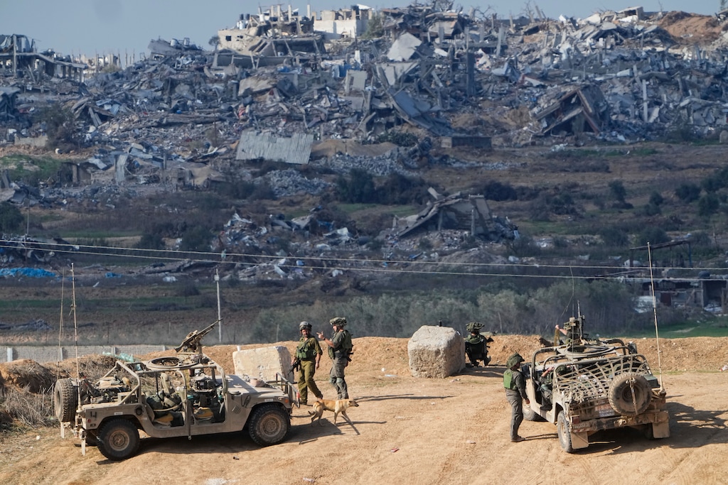 (Ariel Schalit | AP) Israeli soldiers take up positions near the Gaza Strip border, in southern Israel, Friday, Dec. 29, 2023.