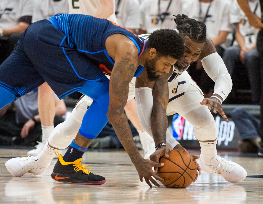 (Rick Egan  |  The Salt Lake Tribune)    Oklahoma City Thunder forward Paul George (13) goes for a loose ball along with Utah Jazz forward Jae Crowder (99), in game 4, NBA playoff action between Utah Jazz and Oklahoma City Thunder, in Salt Lake City, Monday April 23, 2018.