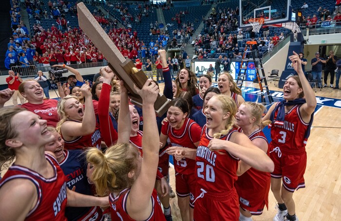 (Rick Egan | The Salt Lake Tribune) The Springville Red Devils celebrate their 54-43 win over Lehi, in the Girls 5A State Championship game, at the Marriott Center in Provo, on Saturday, March 5, 2022. 

