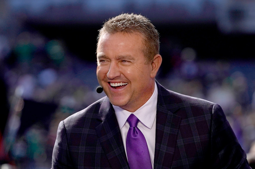 (Charles Rex Arbogast | AP) Kirk Herbstreit laughs on the set of ESPN's College Game Day program in Soldier Field before an NCAA college football game between Wisconsin and Notre Dame Saturday, Sept. 25, 2021, in Chicago. Herbstreit will call this year's Rose Bowl featuring Utah and Penn State.