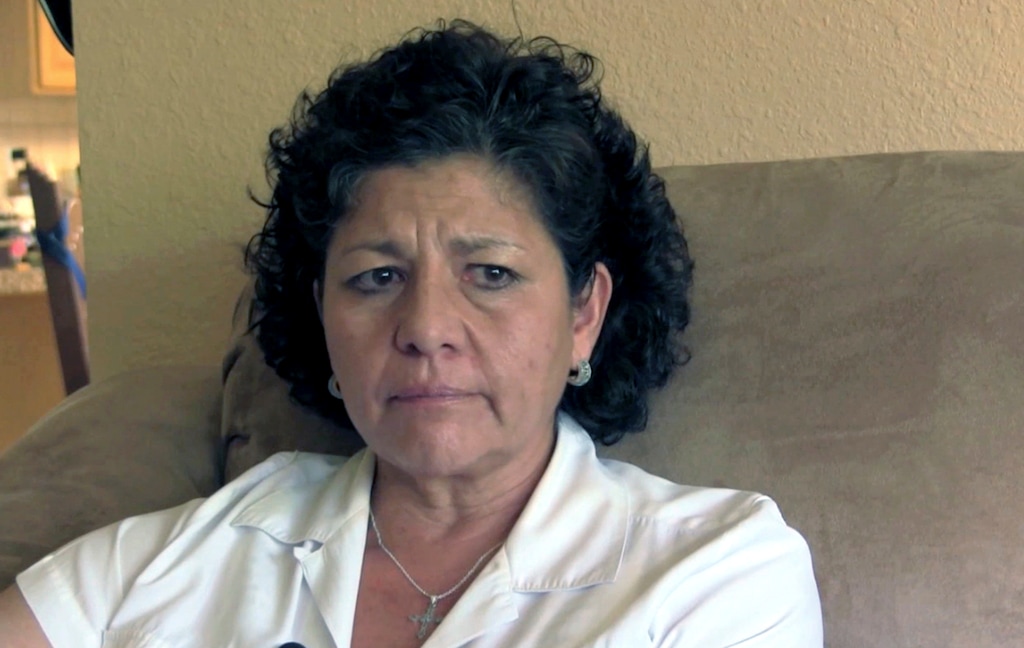 FILE - In this Tuesday, July 14, 2015 file photo from video, Tina Cordova talks of her late father, Anastacio Cordova, in her Albuquerque home. Cordova believes her father, who died in 2013 after suffering from multiple bouts of cancer, was affected by the atomic bomb Trinity Test in New Mexico since he lived in nearby Tularosa, N.M. as a child. A report is scheduled to be released Friday, Feb. 10, 2017, on the health effects of the people who lived near the site of the world's first atomic bomb test. The Tularosa Basin Downwinders Consortium will release the health assessment report Friday on residents of a historic Hispanic village of Tularosa near the Trinity Test in the New Mexico desert. (AP Photo/Russell Contreras,File)