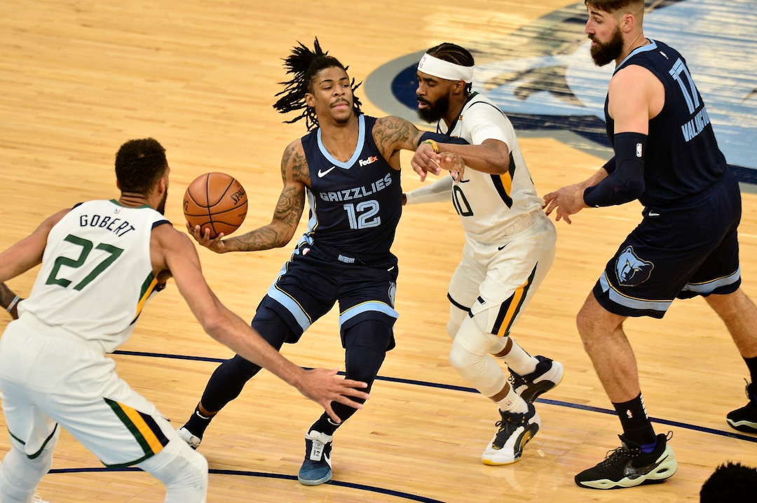 (Brandon Dill |The Associated Press) Memphis Grizzlies guard Ja Morant (12) handles the ball against Utah Jazz guard Mike Conley (10) in the first half of Game 4 of an NBA basketball first-round playoff series Monday, May 31, 2021, in Memphis, Tenn.