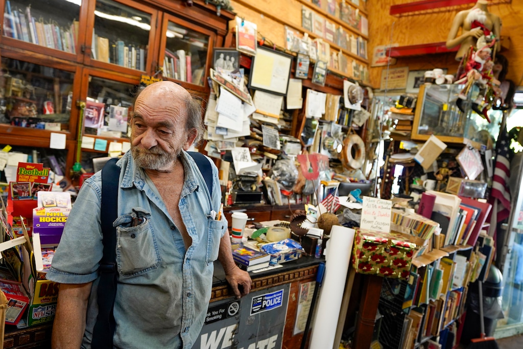 (Chris Samuels | The Salt Lake Tribune) Peter Marshall walks through his store, Utah Book and Magazine, on Main Street in Salt Lake City, Wednesday, Aug. 13, 2025. The store was spared from a fire that destroyed four businesses next door.