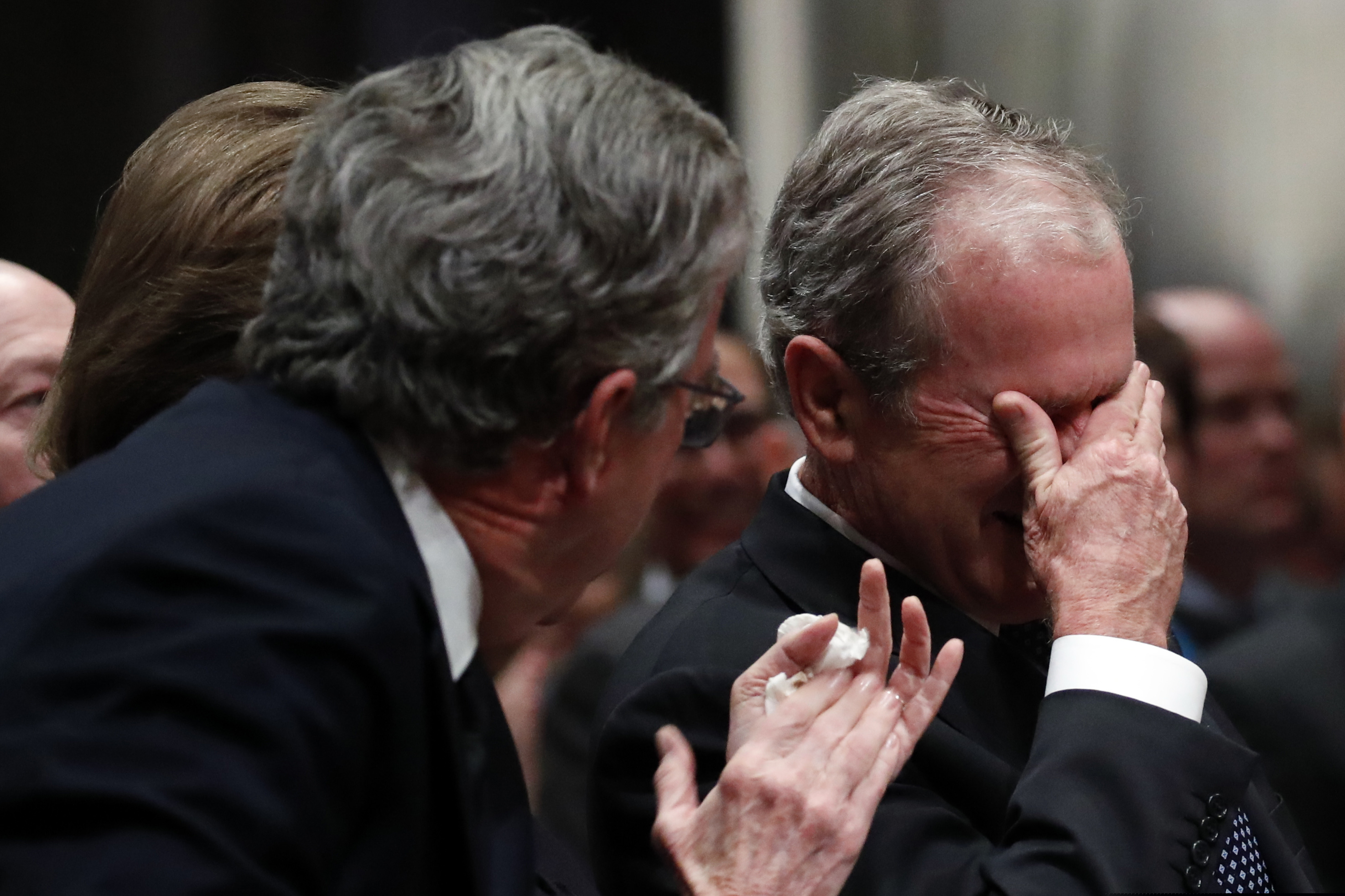 Former President George W. Bush, right, cries after speaking during the State Funeral for his father, former President George H.W. Bush, at the National Cathedral, Wednesday, Dec. 5, 2018, in Washington.(AP Photo/Alex Brandon, Pool)
