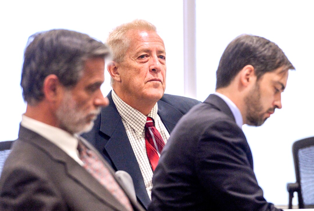 (Leah Hogsten  |  The Salt Lake Tribune)  Robert Lyman, center, sits with his defense attorneys, Andrew Deiss, left, and Corey D. Riley, right. Lyman was bound over for trial and pleaded not guilty to charges of reckless burning and burning during a closed fire season before Judge James Brady in Fourth District Court in Provo, Utah, July 30, 2019. Lyman is accused of starting the June 17, 2017 that burned 71,000 acres and cost an estimated $35 million to fight.Ê