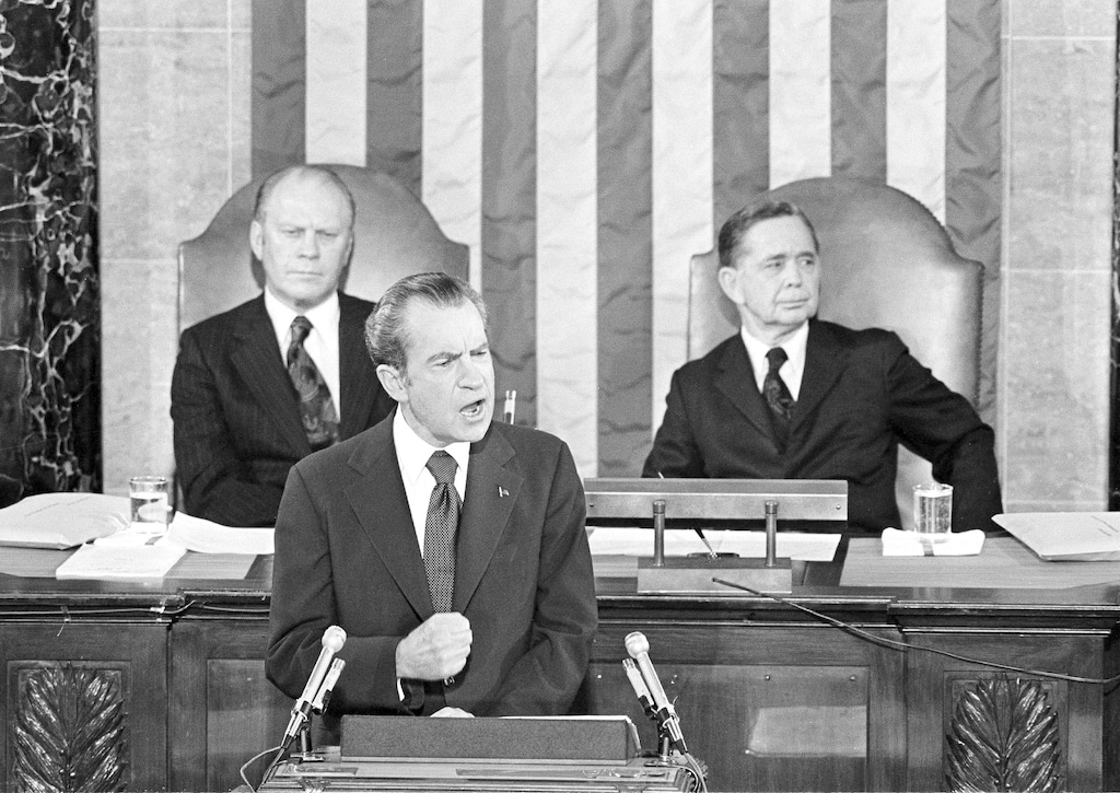 (AP file photo) In this Jan. 30, 1974, file photo Vice President Gerald Ford and House Speaker Carl Albert listen to President Richard Nixon deliver his State of the Union address to a joint session of Congress in Washington.