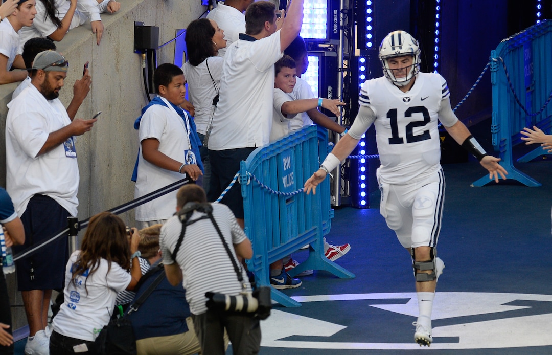 (Francisco Kjolseth  |  The Salt Lake Tribune)  DUPLICATE***Brigham Young Cougars quarterback Tanner Mangum takes to the field before of start of their game against the California Golden Bears in the NCAA college football game, Saturday, Sept. 8, 2018, at LaVell Edwards stadium in Provo, Utah.