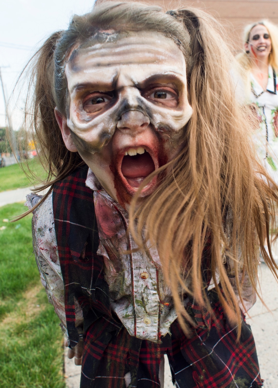    (Rick Egan  |  The Salt Lake Tribune)       Ivy Bryan, 9, scares the locals as she dresses as a zombie in Salt Lake during the 11th annual Salt Lake Zombie Walk, Sunday, Aug. 26, 2018.