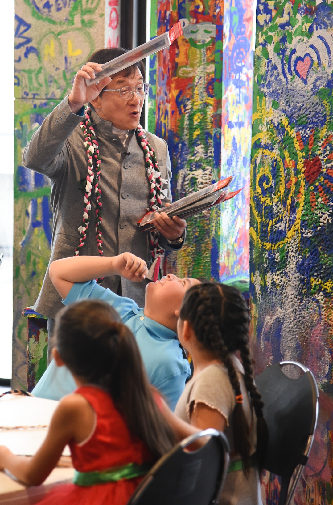 (Francisco Kjolseth  |  The Salt Lake Tribune)  Jackie Chan meets with Mountain View Elementary students as he hands out rulers with an embedded strip of recycled film from one of his movies making every one unique during a workshop as part of a preview of Jackie ChanÕs Inaugural Environmental Exhibition ÔJackie Chan: Green HeroÕ at The Leonardo: Museum of Creativity and Innovation on Thursday, Jan. 24, 2019.