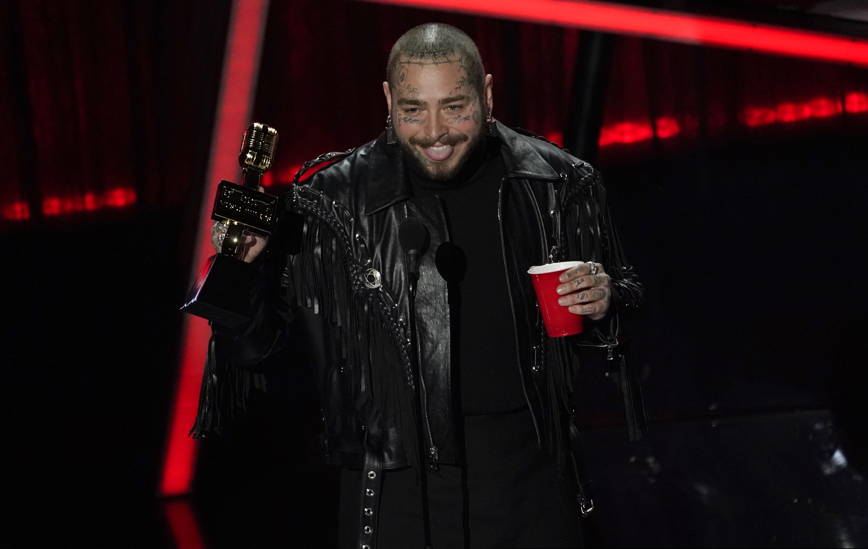 (Chris Pizzello | AP) Post Malone accepts the top artist award at the Billboard Music Awards on Wednesday, Oct. 14, 2020, at the Dolby Theatre in Los Angeles.