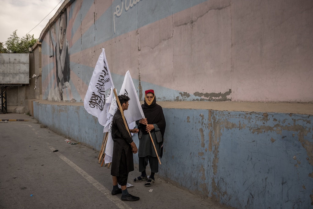 (Jim Huylebroek | The New York Times)
Men sell Taliban flags outside the U.S. Embassy in Kabul, Afghanistan, Aug. 22, 2021. "There was never a decent way to leave the country, which is why we fought a futile war for 20 years. But there also wasn’t a decent way to stay," writes New York Times columnist Michelle Goldberg.