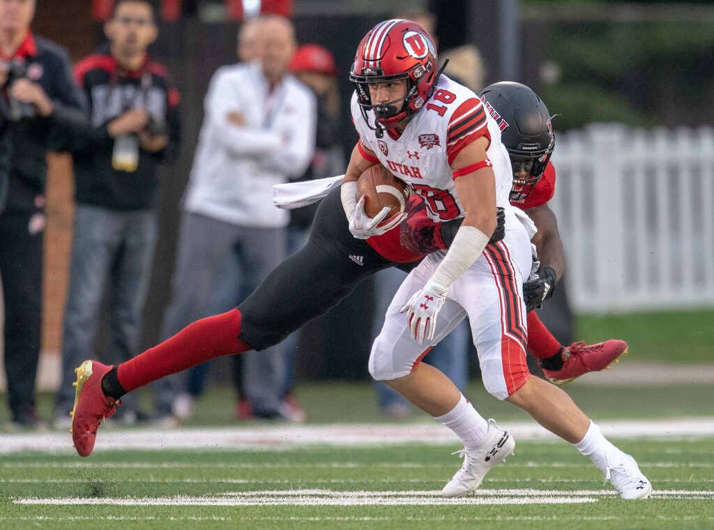 Utah Utes wide receiver Britain Covey (18) attempts to run after the catch against NIU safety Trayshon Foster (11) during a college football game at Huskie Stadium in DeKalb, IL on Saturday, Sept. 08, 2018 (Sean King | for The Salt Lake Tribune)